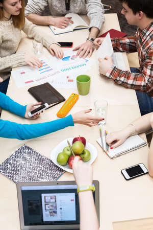 Group Business DIscussion at table Vertical over Head Viewの写真素材