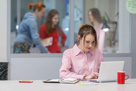 Cute female Businessperson hardworking on white Computerの写真素材