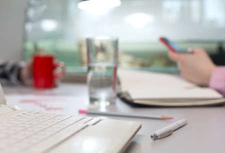 Office Life Concept - Computer Glass of Water and Stationeryの写真素材