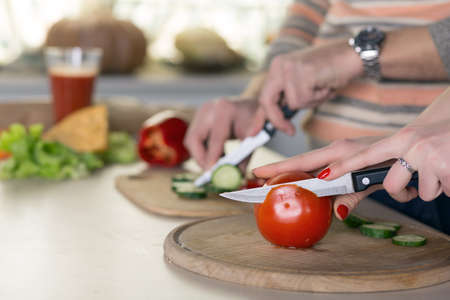 Family cooking Salad togetherの写真素材