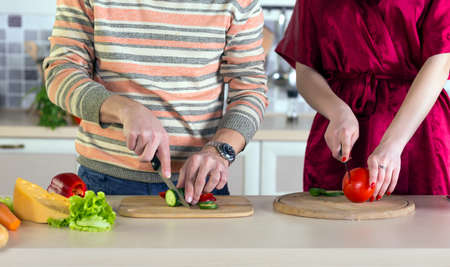 Family cooking Salad togetherの写真素材