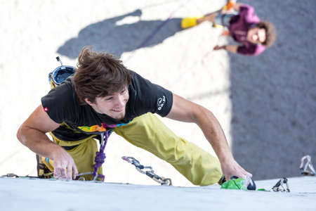 Athlete on climbing Wall and belaying referee watching himのeditorial素材