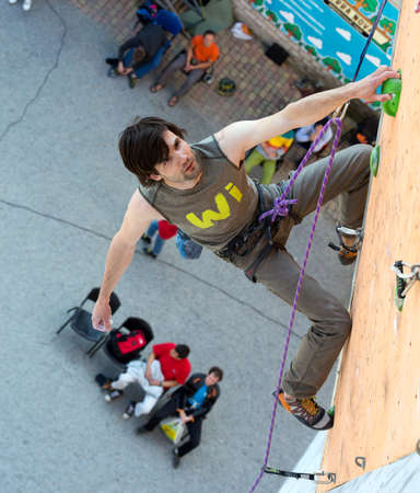 Climber hanging on climbing Wall at Competitionsのeditorial素材