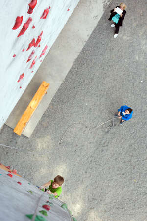Little boy Climber on Wall belaying partner and motherのeditorial素材