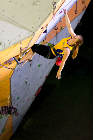 Climber hanging on Climbing Wallのeditorial素材