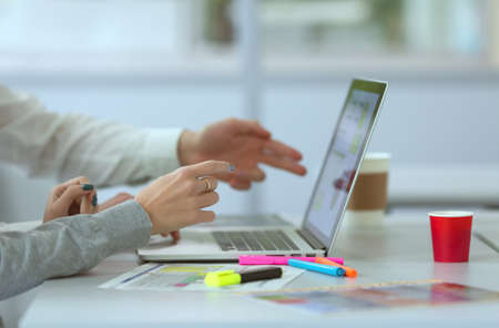 Team discussing Project pointing on Computer at modern Officeの写真素材