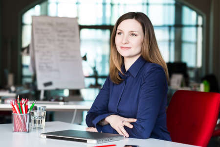 Beautiful Business Lady enjoying good Job well doneの写真素材
