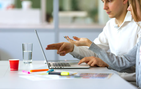 Image of young Business Team discussing Project at Computer