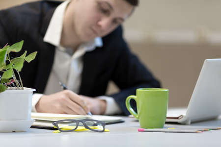 Businessman making Hand notes at Office working Placeの写真素材