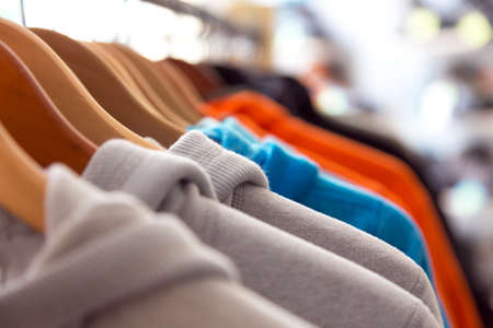 Row of Spring Seasonal Apparel on Hangers of Retail Shopの写真素材