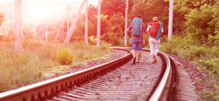 Two young Hikers walking along Railroadの写真素材