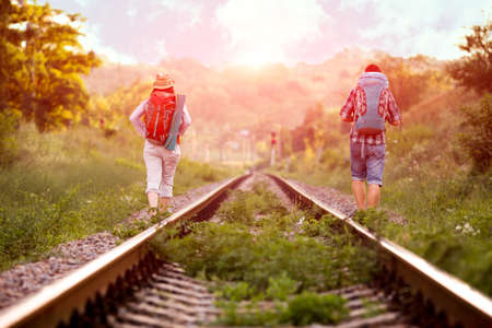 Two young Hikers walking along old Country Railroadの写真素材