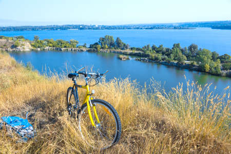 Rural View tih River and Grass and Cycleの写真素材