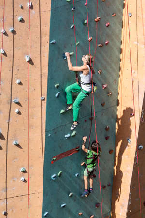 Mother and Son doing rock climbing togetherの写真素材