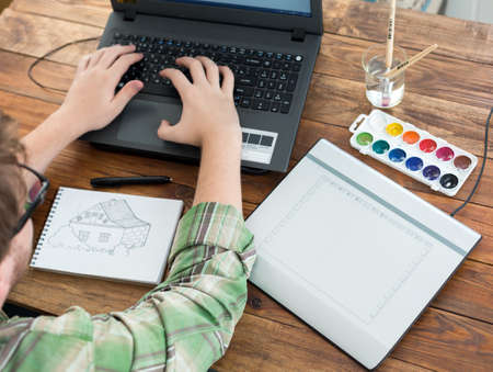 Artist drawing Sketch on Graphic Tablet Top Viewの写真素材