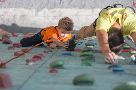 Father and son perform speed climbing relay raceのeditorial素材