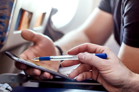 Man and Woman using modern Telephone in the Aircraft close up