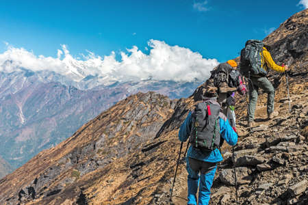 People travelling in Mountains on extreme Terrainの写真素材