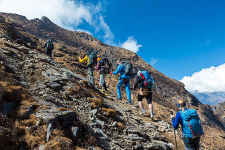 Mixed Group of Athletes ascending Mountainの写真素材