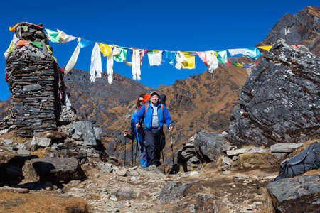 Smiling Hiker enjoying his walk on Mountain Passの写真素材