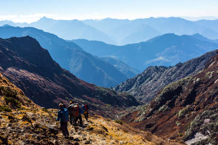 Group of People with Backpacks walking on Trail on Himalaya Trekの写真素材