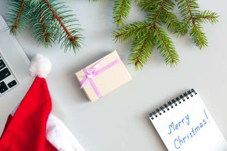 Office Christmas Composition with Computer and Gift Boxの写真素材