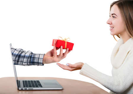 Man greeting Wife throw Internet Hand giving Giftの写真素材