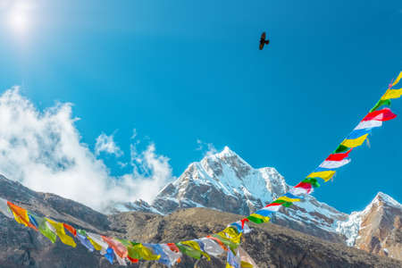Sunny Peak View in Himalaya Mountains buddhist Flags and Crowの写真素材