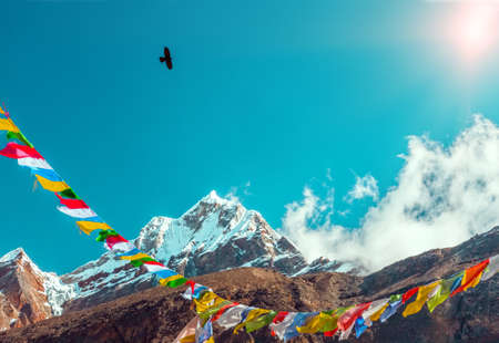 Sunny Peak View in Himalaya Mountains buddhist Flags and Crowの写真素材