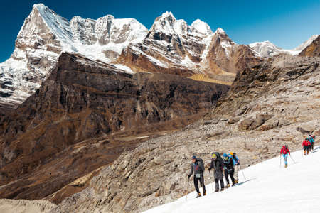 Alpine Climbers Team moving on Glacier high Mountains View Backgroundの写真素材