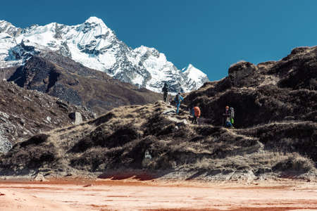 Old style coloured View of Hikers in Mountain Terrainの写真素材