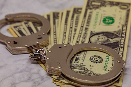 Handcuffs and moneyの写真素材