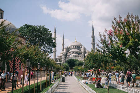 Istanbul, Turkey - July 2014. Tourists in the summer in the park at the Blue Mosque. One of the most tourist places in Istanbulのeditorial素材