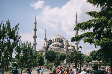 Istanbul, Turkey - July 2014. Tourists in the summer in the park at the Sultanahmet Blue Mosque. One of the most tourist places in Istanbulのeditorial素材