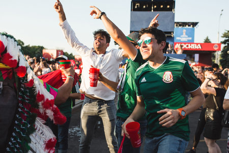 MOSCOW, RUSSIA - JUNE 2018 Mexican fans rejoice at goal at fan festival