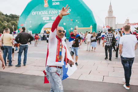 MOSCOW, RUSSIA - JULY 2018 A cheerful football fan in the fan zone during the World Cup