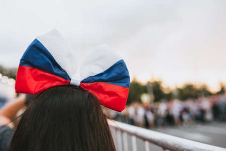 Bow at the womens head painted in the colors of the Russian flag. Horizontalの写真素材