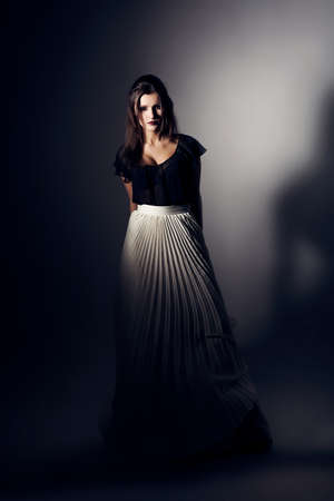 pretty woman in white skirt and black topの写真素材