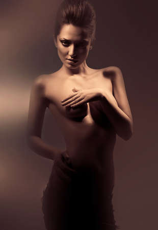 sexy erotic nude woman in dirty mistの写真素材
