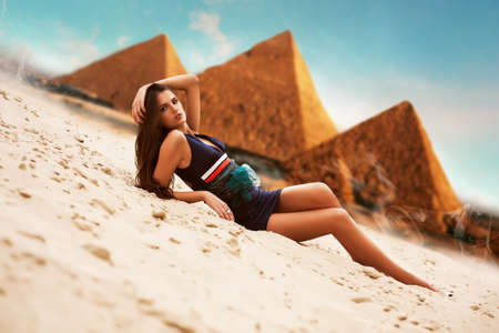 attractive woman in egypt on pyramid backgroundの写真素材