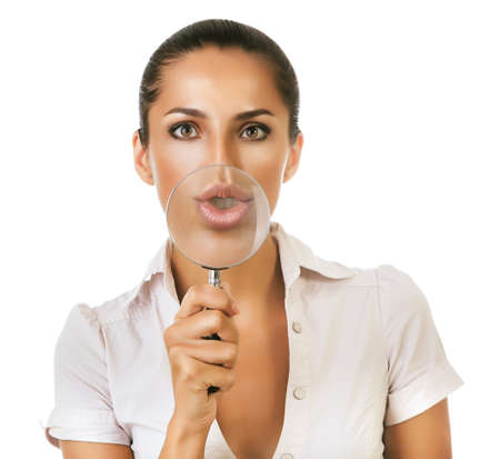beautiful woman with magnifying glass on white backgroundの写真素材