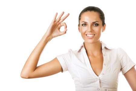 businesswoman is showing ok gesture on white backgroundの写真素材