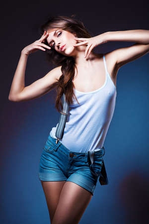 posing sexy woman in shorts with suspendersの写真素材