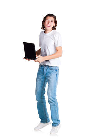 happy student is loughing with laptop in his hands on white backgroundの写真素材