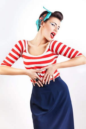 portrait of beautiful flirting woman with red lipsの写真素材