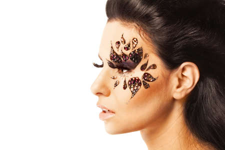 portrait of a beautiful woman with Creative Fashion Makeup.Holiday Make-up on white backgroundの写真素材