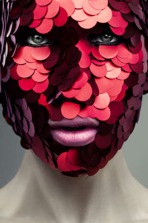 Face in creative mask close-upの写真素材