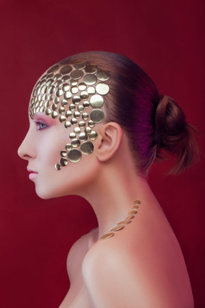 Portrait of a woman with squama-like sequins on her faceの写真素材