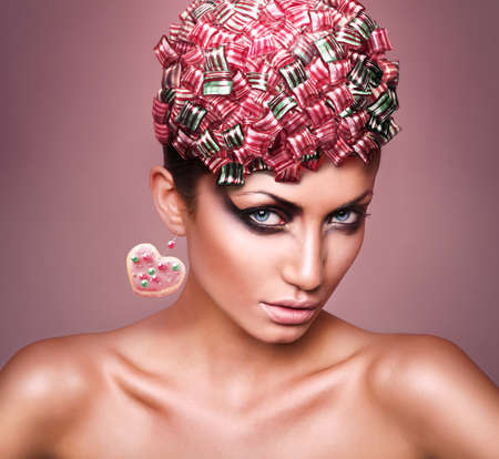 woman with candies in headの写真素材