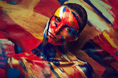 portrait of young girl in paintsの写真素材